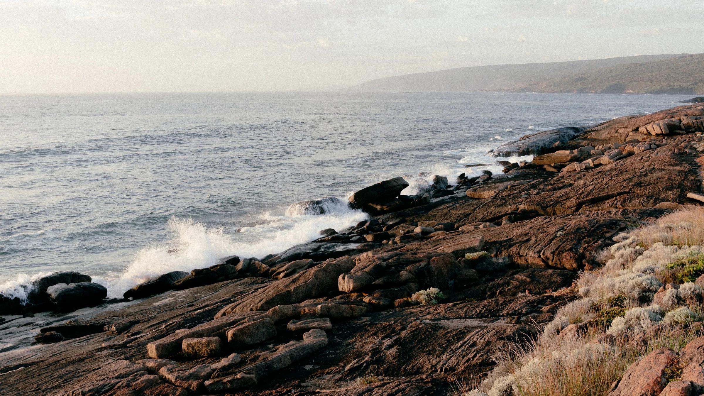 Waves Breaking on Weathered Coastal Rock