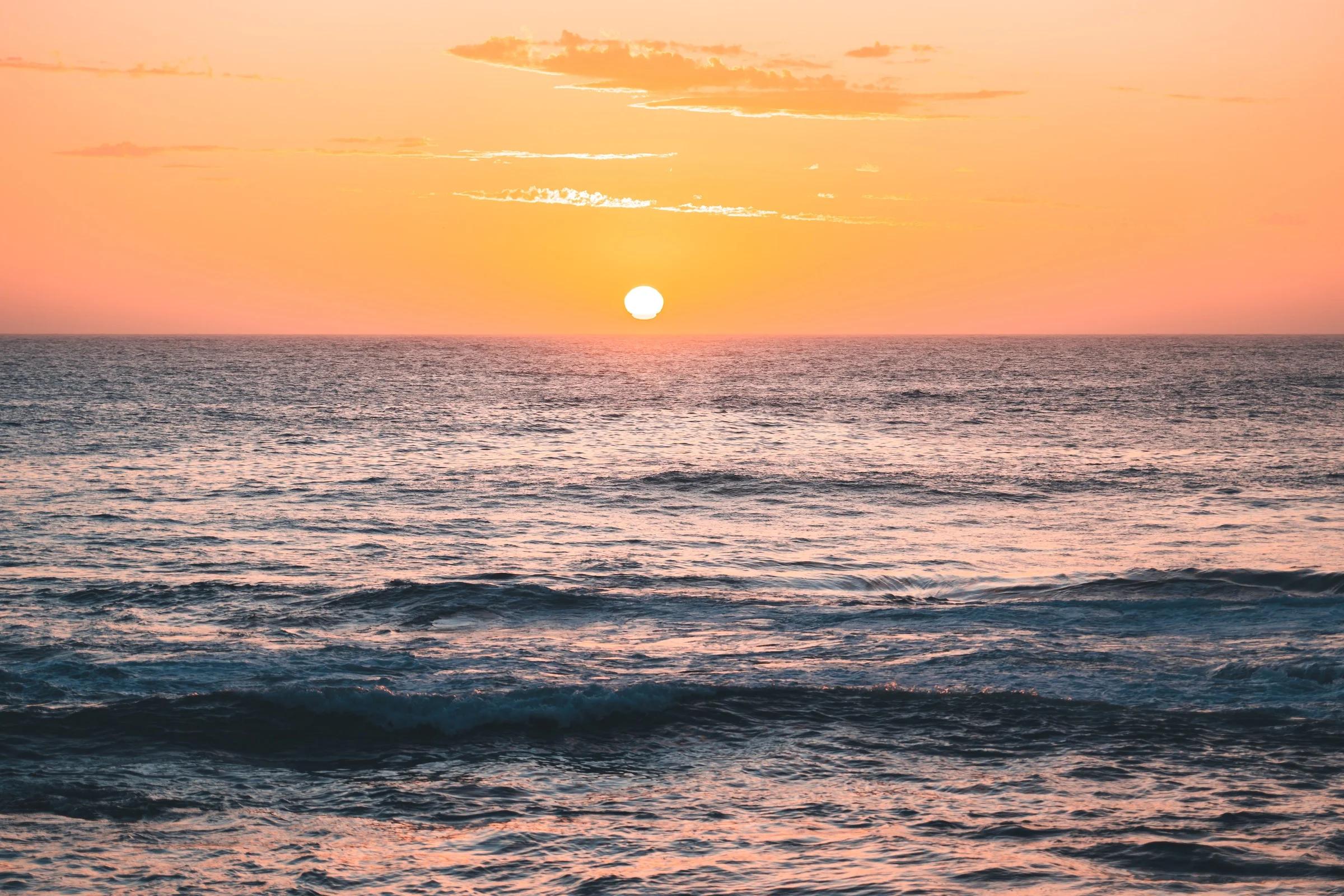 Golden Sun Melting Into the Sea